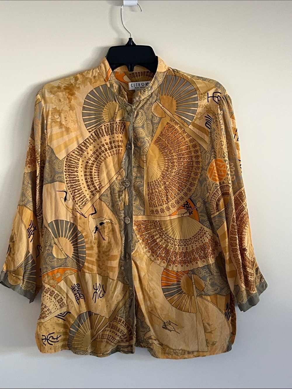Citron Women’s 100% silk lightweight blouse with a Golden and Asian design.